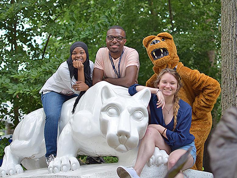 four students on lion shrine